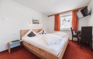 Posteľ alebo postele v izbe v ubytovaní Berghotel-Gasthof Gstrein