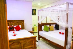 Letto o letti in una camera di Galaxy View Homestay Sigiriya