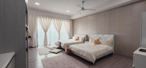 a bedroom with a bed and a large window at Anggun I Soho I City Homestay in Shah Alam +48 photos