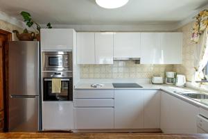 A kitchen or kitchenette at 2BR Beach House - Solarium & Shower Terrace - 12