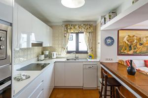 A kitchen or kitchenette at 2BR Beach House - Solarium & Shower Terrace - 12