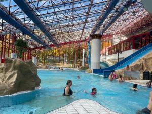 a group of people in a swimming pool at "Altes Haus" am Kurpark in den Bergen in Zorge
