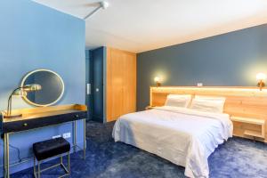 Voodi või voodid majutusasutuse HOTEL TURAN toas