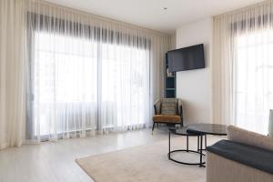 Televízia a/alebo spoločenská miestnosť v ubytovaní Apartamento Málaga Halia