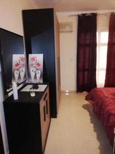 A bed or beds in a room at Comfortable studio in madinaty compound B11