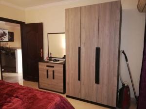 A bed or beds in a room at Comfortable studio in madinaty compound B11