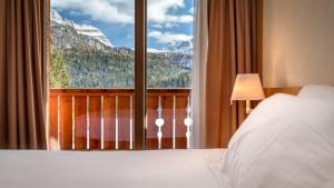 Postel nebo postele na pokoji v ubytování Maribel Hotel