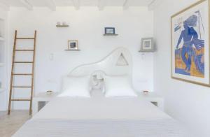 Rúm í herbergi á Villa Maestro Mykonos