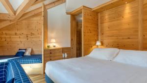 Postel nebo postele na pokoji v ubytování Maribel Hotel