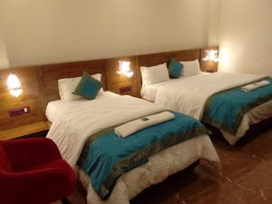 Postel nebo postele na pokoji v ubytování Namaste Benares Varanasi