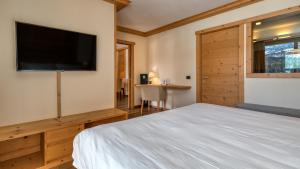 Postel nebo postele na pokoji v ubytování Maribel Hotel