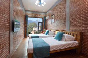 Krevet ili kreveti u jedinici u okviru objekta Leisurely River View Inn - Three Gorges Branch