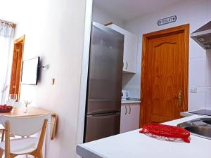 A kitchen or kitchenette at Apartament z basenem, przy plaży