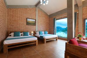 Krevet ili kreveti u jedinici u okviru objekta Leisurely River View Inn - Three Gorges Branch