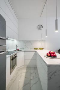 Virtuvė arba virtuvėlė apgyvendinimo įstaigoje Charming apartment in calm and central area