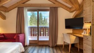 Postel nebo postele na pokoji v ubytování Maribel Hotel