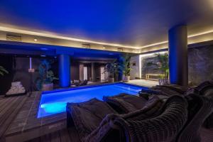 a swimming pool in the middle of a house at The Capital 15 on Orange Hotel & Spa in Cape Town