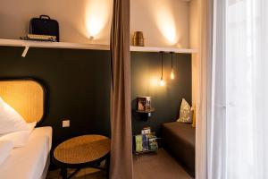 Postel nebo postele na pokoji v ubytování grätzlhotel Karmelitermarkt