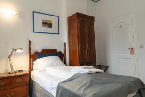 Postel nebo postele na pokoji v ubytování Hotel Petit Wannsee