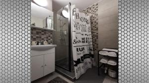 a bathroom with a shower with a sink and a mirror at Vi’studio in Sibiu +31 photos