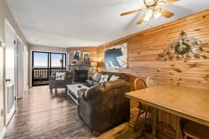 a living room with a couch and a table at Mountain Top Retreat in Gatlinburg