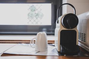 Coffee and tea making facilities at AZZ Sevilla Torre de la Plata Apartamentos