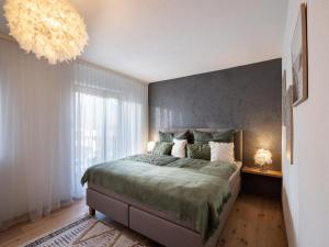 Postel nebo postele na pokoji v ubytování Ferienwohnung Dahoam + 25 fotografií