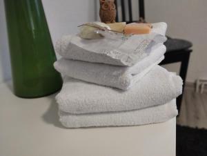 a stack of white towels sitting on a counter at Harzpension Haus Königskopf in Braunlage