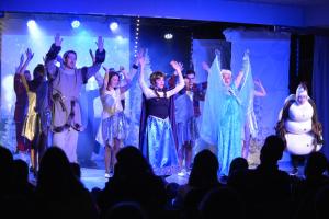 a group of people on a stage with their hands in the air at Villages Clubs du Soleil - LES 2 ALPES in Les Deux Alpes