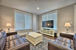 a living room with two couches and a flat screen tv at Suites on Seneca - Lovely 2 Bed 1 Bath Apartment in Harrisburg