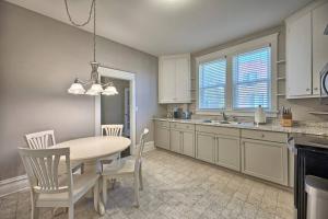 a kitchen with a table and chairs and a dining room at Suites on Seneca - Lovely 2 Bed 1 Bath Apartment in Harrisburg +16 photos