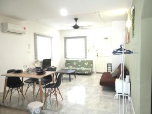 a living room with a table and a couch at Polo Park Apartment near mid valley southkey in Johor Bahru