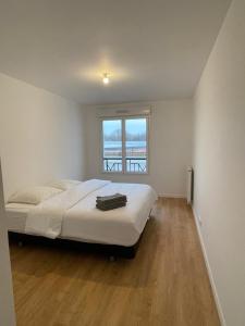 Posteľ alebo postele v izbe v ubytovaní Appartement Saint ouen proche stade de france