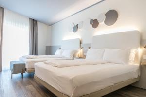 Кровать или кровати в номере Mediterranee Family Hotel & Spa