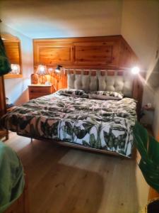 Cama o camas de una habitación en La Casetta di Ale -- LIVATA CAMPO DELL'OSSO - Il Bucaneve