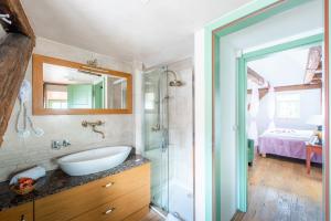a bathroom with a sink and a shower at Nobles Apartments in Prague +121 photos