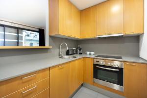 Kuchyňa alebo kuchynka v ubytovaní Enjoy Apartments Maria II