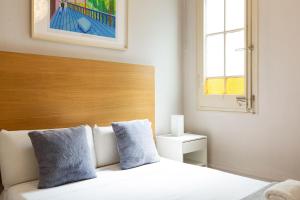 Postel nebo postele na pokoji v ubytování Sagrada Familia III by Enjoy Apartments
