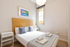 Postel nebo postele na pokoji v ubytování Sagrada Familia III by Enjoy Apartments