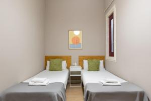 Posteľ alebo postele v izbe v ubytovaní Sagrada Familia I by Enjoy Apartments