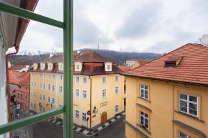 a view of a city from a window at Nobles Apartments in Prague