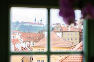 a view of a city from a window at Nobles Apartments in Prague