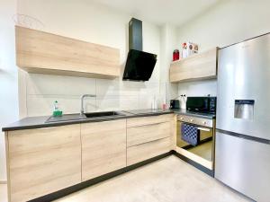Kuchyň nebo kuchyňský kout v ubytování COLMAR - Appartements Deluxe - Lumineux - Stationnement Gratuit et Facile dans la rue