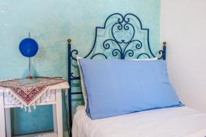 A bed or beds in a room at Villino Agave