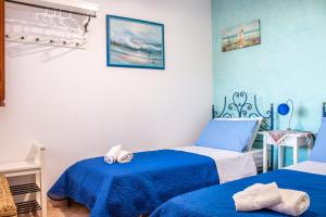 A bed or beds in a room at Villino Agave