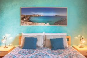 A bed or beds in a room at Villino Agave