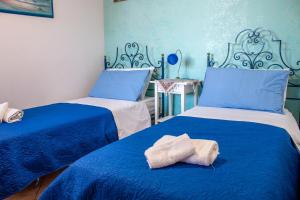 A bed or beds in a room at Villino Agave