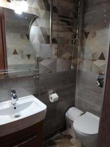 a bathroom with a sink and a toilet at Willa u Marii in Zakopane