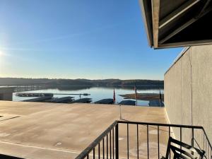 a balcony with a view of a body of water at Lake Norfork Resort in Henderson
