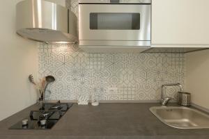 Η κουζίνα ή μικρή κουζίνα στο Isule Apartments +67 φωτογραφίες